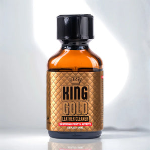 A small amber-colored bottle with a black cap, labeled "King Gold Poppers 24ml." The label features a quilted pattern design and text indicating "XXXSTRONG PENTYL NITRITE" and "0.88 FL OZ - 24ml."