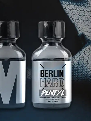 Five small bottles with labels on a dark background, featuring the text 'Thrifty Shades of Gay'.